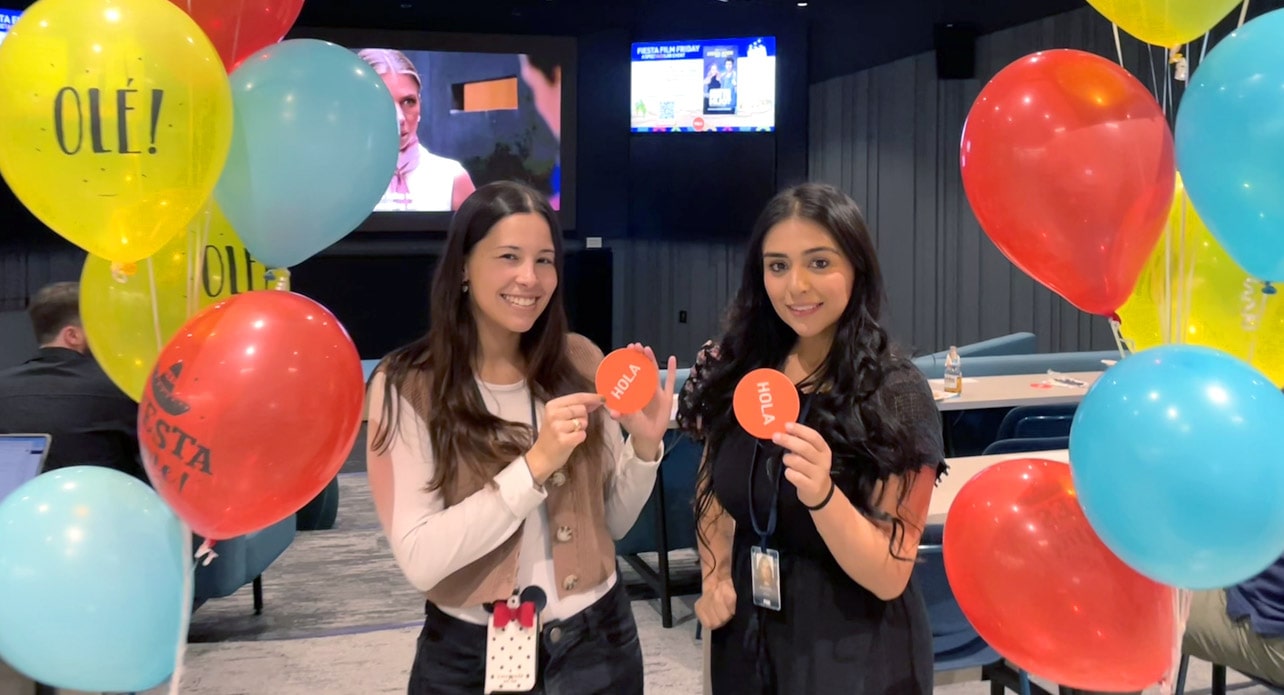 Two FOX employees posing at a HOLA event